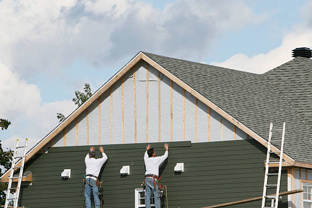 Professional Siding Installation technician working in Denton, MD